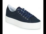 a close up of a pair of blue sneakers with white soles