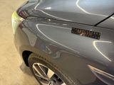 a close up of a car with a sticker on it ' s hood
