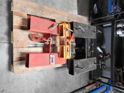 a wooden pallet with tools on it in a garage