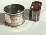 a silver cup and a silver box on a table