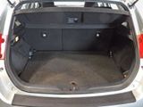 a trunk of a car with the back seats folded down