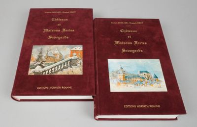 two red books sitting on top of a table next to each other