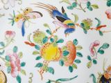 a picture of a decorative plate with birds and flowers on it