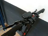 a bike that is leaning against a wall with a handlebar