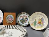a lot of plates and bowls on the table