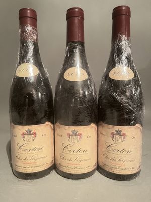 three bottles of wine sitting on top of a table next to each other