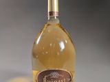 a bottle of wine that is sitting on a table