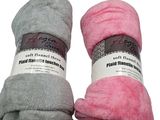 two balls of pink and grey yarn sitting on top of each other