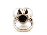 an image of a silver ring with a black stone in the center