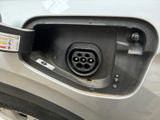 a close up of a car ' s fuel tank with a plugged in