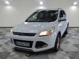 the white ford kuga is parked in a large room