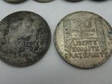 two old silver coins and one silver one with a picture of a man on it