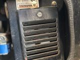 a close up of the front of a vehicle with the door open