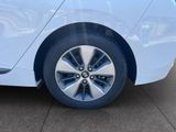 a close up of a tire on a white car