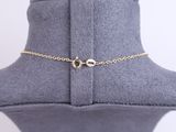 a close up of a mannequin with a gold chain on it