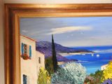 a painting on the wall of a house with a view of the ocean