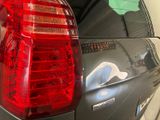 a close up of a car ' s tail light with a sticker on it