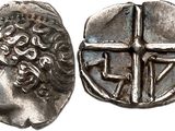a silver coin with an image of a man and a cross on it