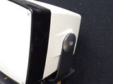 a small television sitting on top of a box next to a remote control