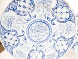 two plates with blue and white designs on them