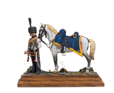 figurine of a soldier with a horse on a wooden base