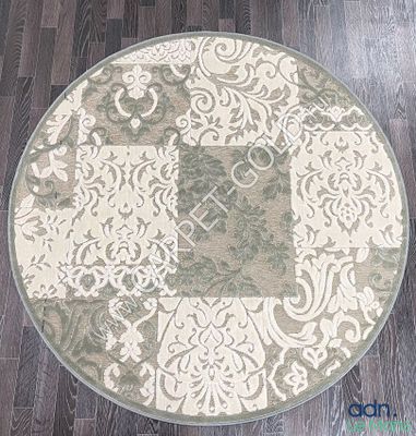 une photo d'un tapis rond posé sur un parquet
