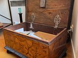 an old trunk sitting on the floor in a room