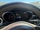 dashboard of a car with a steering wheel and various gauges