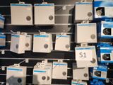 a wall of electronics for sale in a store