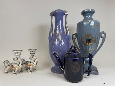 three vases and a teapot sitting on a table