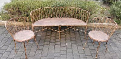 three chairs and a table sitting on a brick patio
