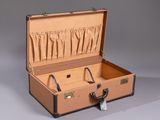 an open suitcase with a handle on a gray background