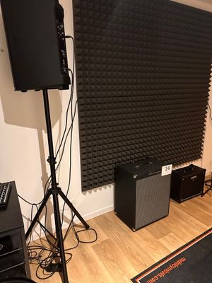 a room with speakers, speakers, and speakers on the floor