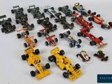 a lot of toy cars that are sitting on a table