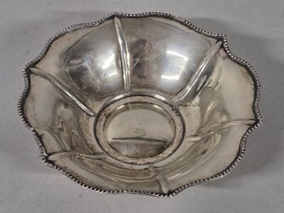 a silver bowl that is sitting on a table