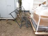 a pile of boxes and chairs in the yard