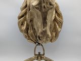 an image of a sculpture of a horse ' s head on a stand