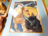 un tableau représentant un homme et un chien, dans un cadre