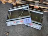 two ovens that are sitting on the ground next to each other