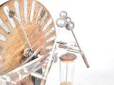 a clock that is made out of wood and metal