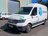 a white van that is parked in front of a building