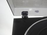 a cell phone that is sitting on top of a record player