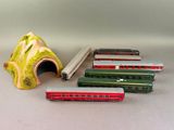 several toy trains are lined up next to each other on a table