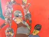 une peinture représentant un homme et une femme sur un mur rouge