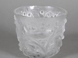 a glass cup with a design on it
