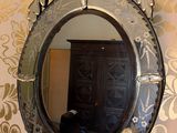 a mirror on the wall above a sink in a bathroom