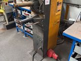 a machine that is sitting in a room with a lot of tools