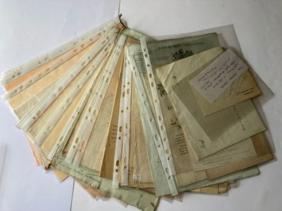 a lot of old papers that are on a table