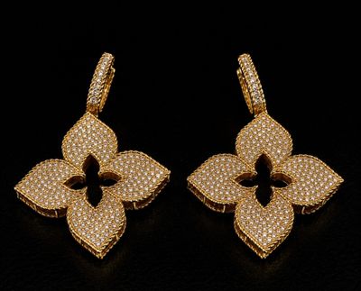 a pair of yellow gold earrings with white diamonds