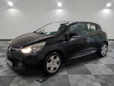 the black car is parked on a checkered floor in the garage
